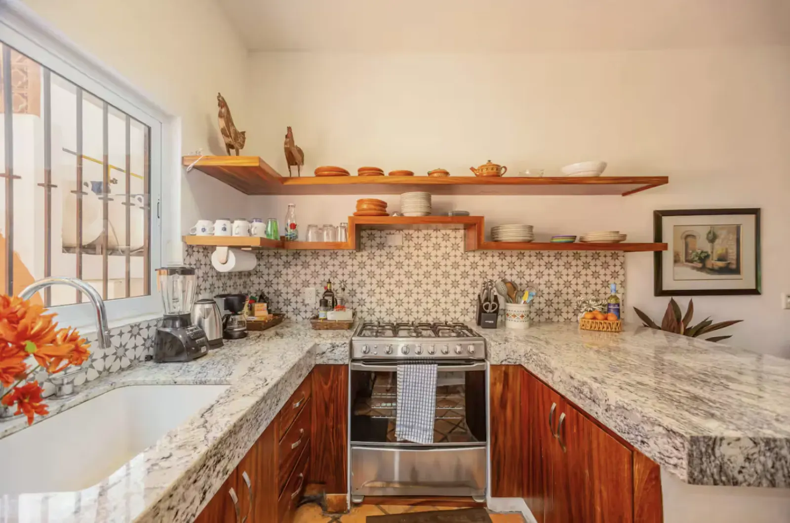 Kitchen with granite countertop and artisan tile