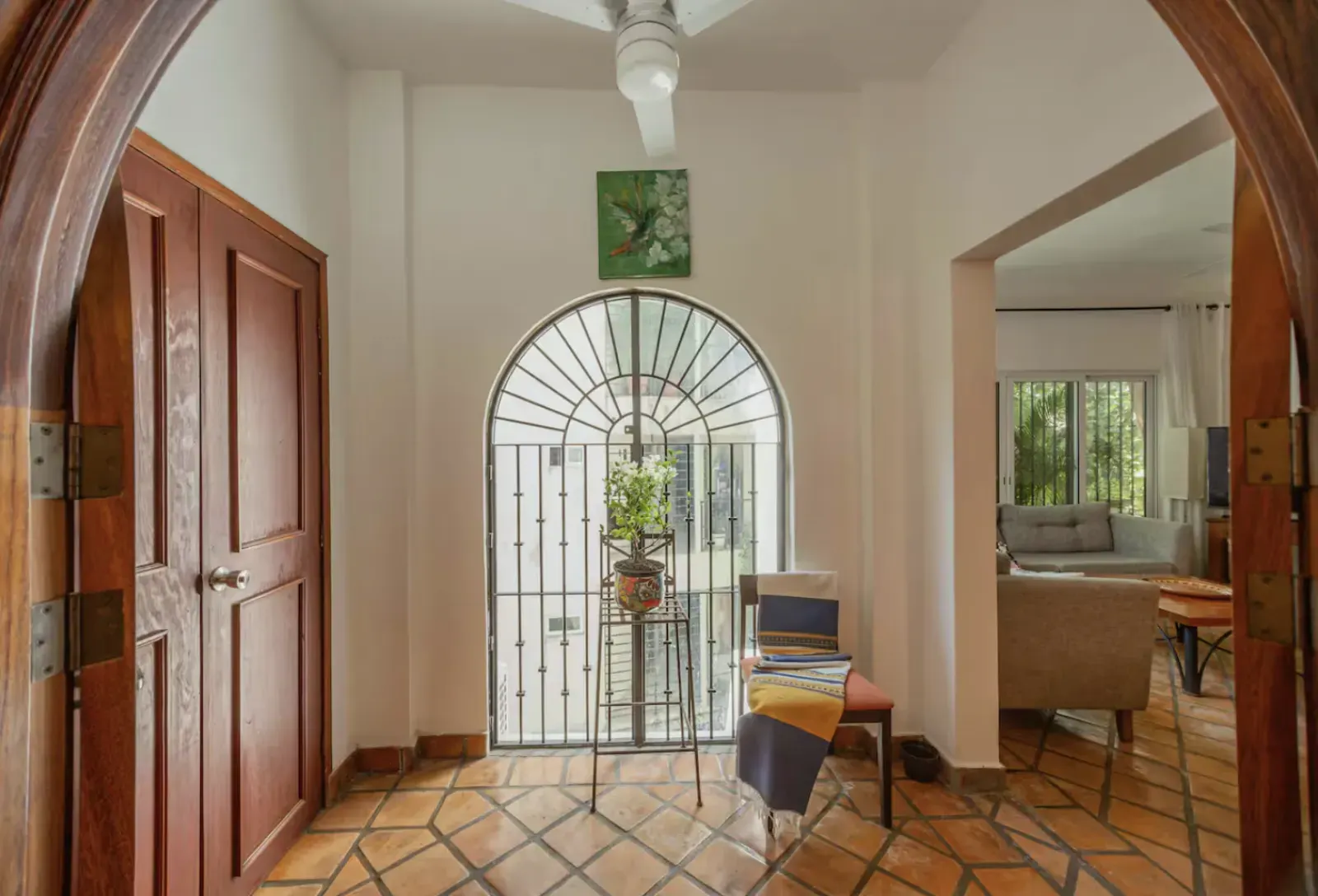 Interior foyer with archway and view toward the living room