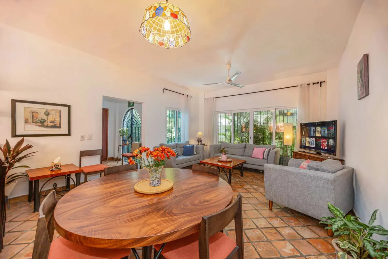 Main living room with TV and dining