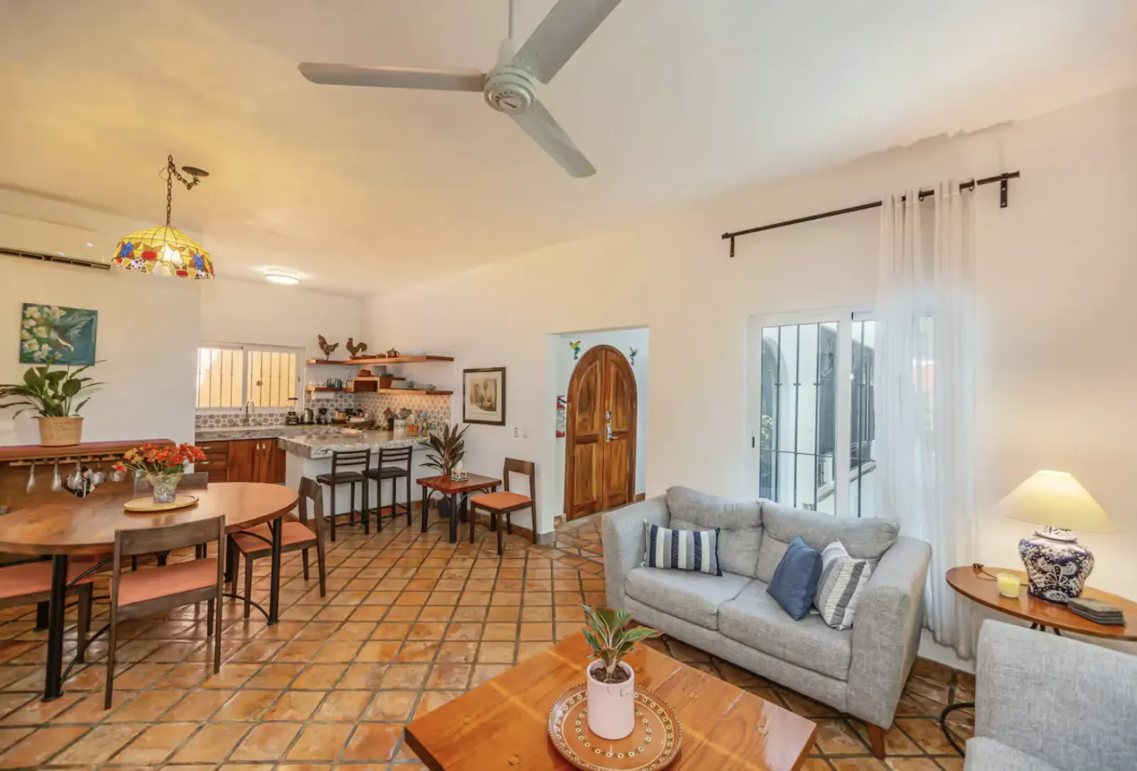 Wide view of living room, dining area and kitchen